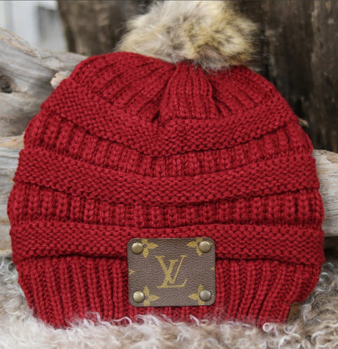 Red Charlie horse hat with Louis Vuitton patch